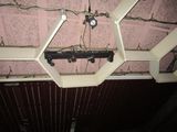 a light that is hanging from the ceiling of a building