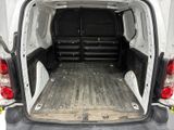 the back of a white van with its cargo door open