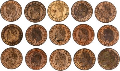 a close up of a bunch of coins on a white surface