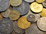 a lot of coins that are sitting on a table