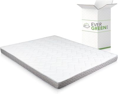 the ever green mattress is next to a cardboard box