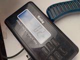 a remote control and a cell phone on a desk