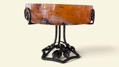 an image of a table with a bowl on it ' s legs
