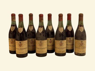 six bottles of wine are lined up in a row on a white background