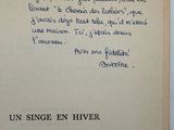 an old book with a poem written in french on it