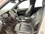 the interior of a car with a steering wheel and leather seats