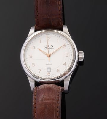 an image of a close up of a wrist watch on a black surface