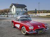a red and white car parked in front of a building
