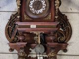 a clock that is on the wall on the floor