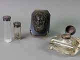 three bottles of perfume sitting next to each other on a table