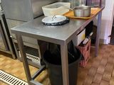 a kitchen with a sink and a counter with dishes on it