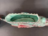 a fish shaped container with a fish inside of it