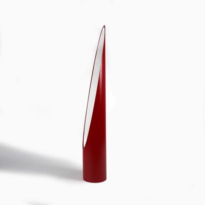 a red vase with a white top and a red base