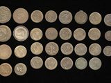 a lot of coins that are on a black surface