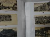 an open book with a bunch of old photos on it