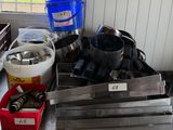a pile of kitchen utensils sitting on a kitchen counter