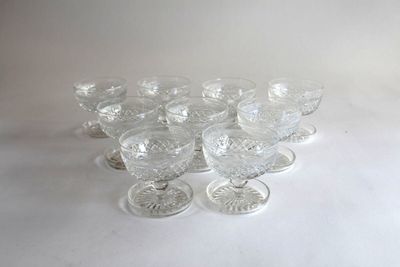 a lot of glasses that are sitting on a table