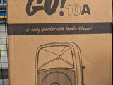 a cardboard box with a picture of a speaker inside of it