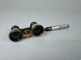 a pair of binoculars sitting on top of a white table