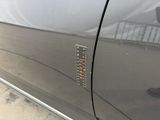 a close up of a car door with a sticker on it