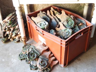 a box full of old shoes and a pile of old shoes
