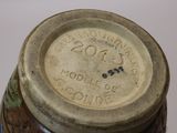 a close up of a vase with a label on it