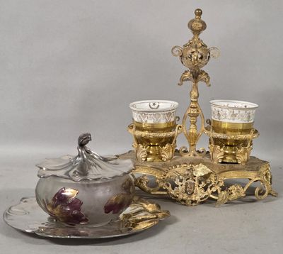 two cups and a saucer sitting on a table