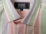 striped shirt on a hanger on a shelf in a room