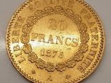 une pièce d'or sur laquelle est inscrit le mot « France »
