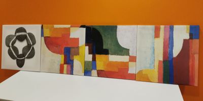 a painting on the wall of a room with orange walls