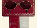 glasses in a red box with gold trimming and a book