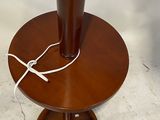 a wooden table with a vase on top of it