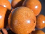 a close up of a bunch of wooden beads