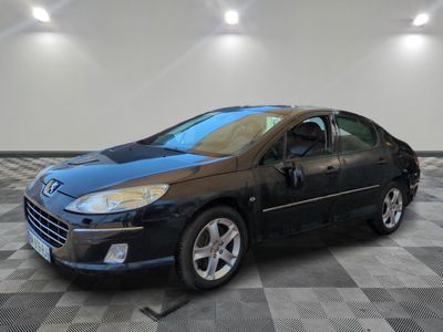a picture of a black car parked in a garage