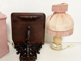two lamps that are next to each other on a table