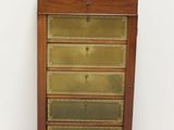 an old wooden cabinet with a glass door and drawers