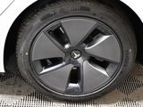 a close up of a tire on a car ' s rim