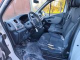 the interior of a van with the driver ' s seat down