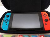 a nintendo switch lite in a case with a video game