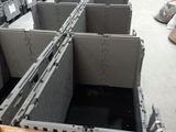 a lot of concrete blocks in a warehouse with pallets