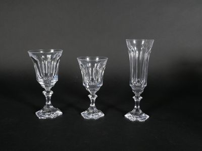 three crystal wine glasses on a black background