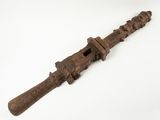 an old wooden knife with a wooden handle on a white surface