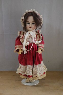 a small doll that is standing on a table