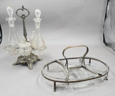 a silver tray with a glass candle holder and a glass candle holder