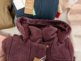 a pile of clothing that is sitting on a table