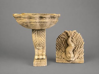two pieces of art that are sitting on top of a table
