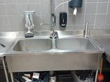 a sink with a faucet in the middle of it