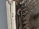 a close up of a metal object with a chain around it