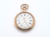 a gold pocket watch with roman numerals on it