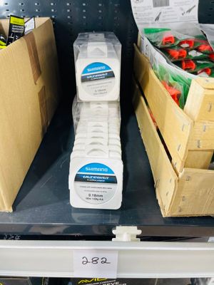 several boxes of toothpaste on a shelf in a store